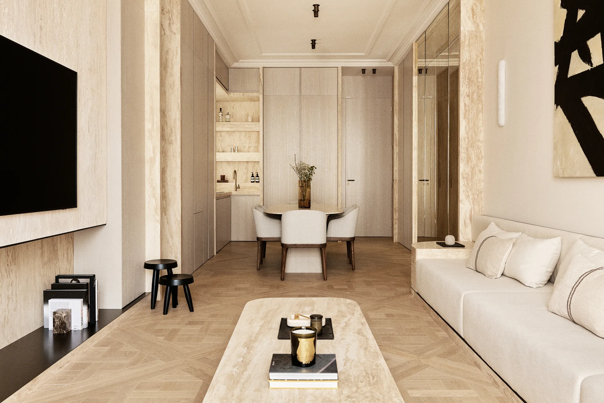 A neutral-toned contemporary living and dining area with a beige sofa, travertine clad columns, a stone coffee table, and herringbone parquet flooring.