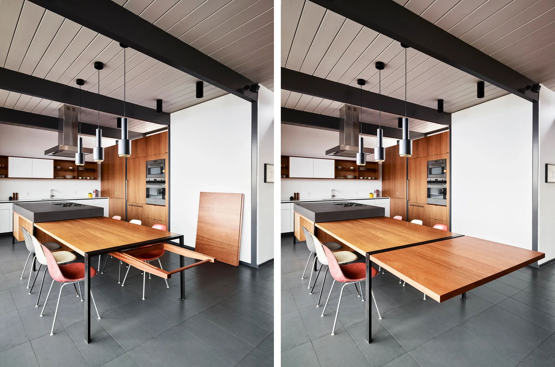 Split view of a modern kitchen showing an extendable wood dining table attached to a dark grey kitchen island beneath exposed black ceiling beams.