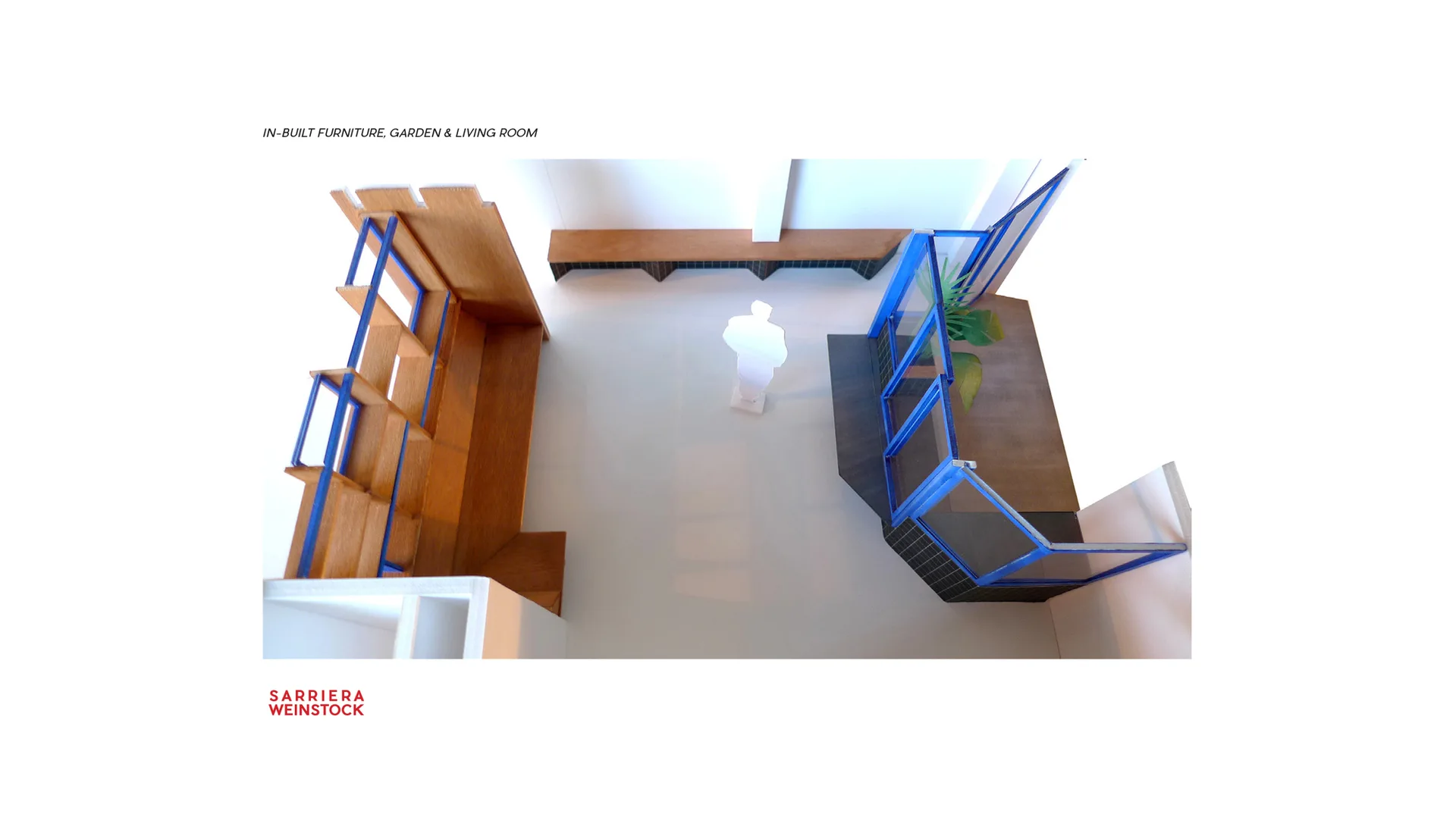 An architectural scale model of a modern living room featuring a wooden built-in shelving unit, a blue-framed glass partition, and a matching bench.