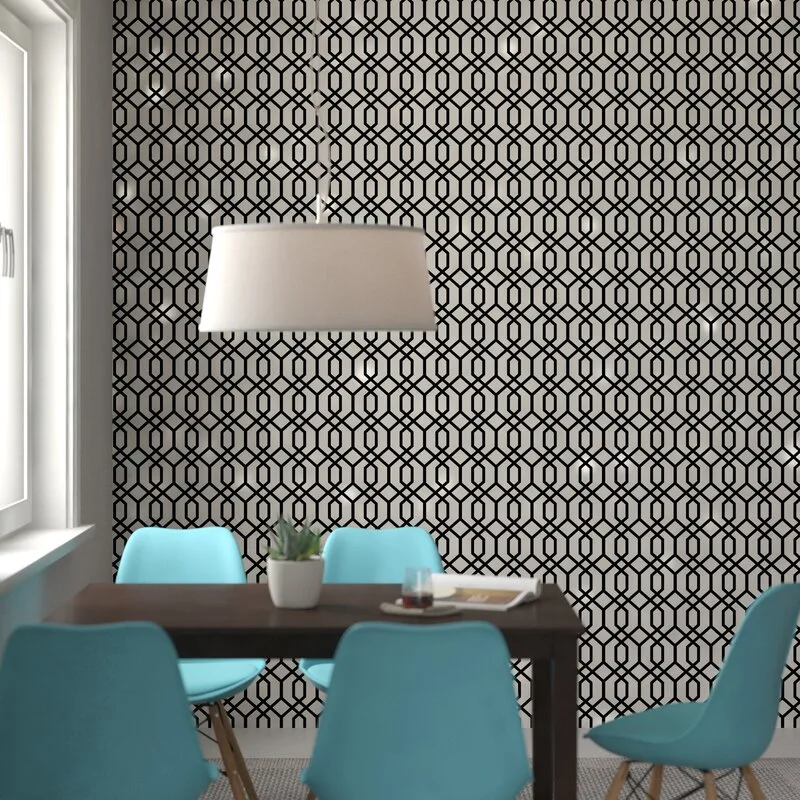 A modern dining room features a dark wood table with blue molded chairs set against a black and white geometric patterned wallpaper wall.
