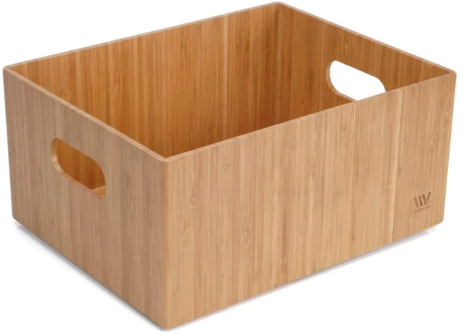 A rectangular bamboo storage bin with side cutout handles rests against a solid white background.