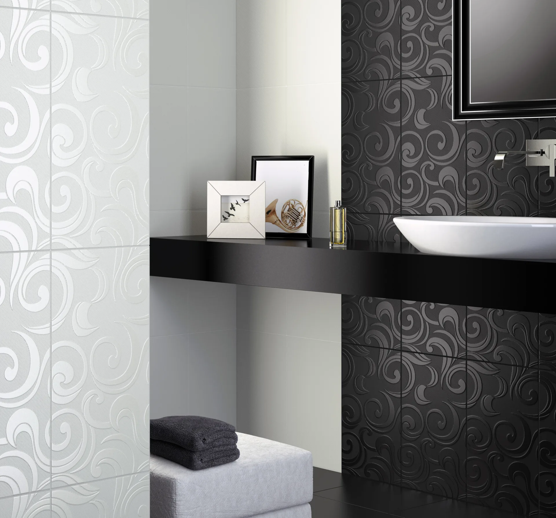 A minimalist black vanity shelf holds a white vessel sink against a backdrop of black and white embossed swirl wall tiles.