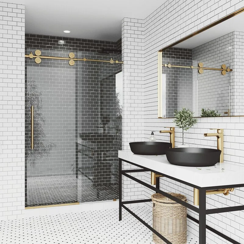 A modern bathroom featuring a double vanity with matte black vessel sinks, brass faucets, white subway tile walls, and a glass-enclosed shower.