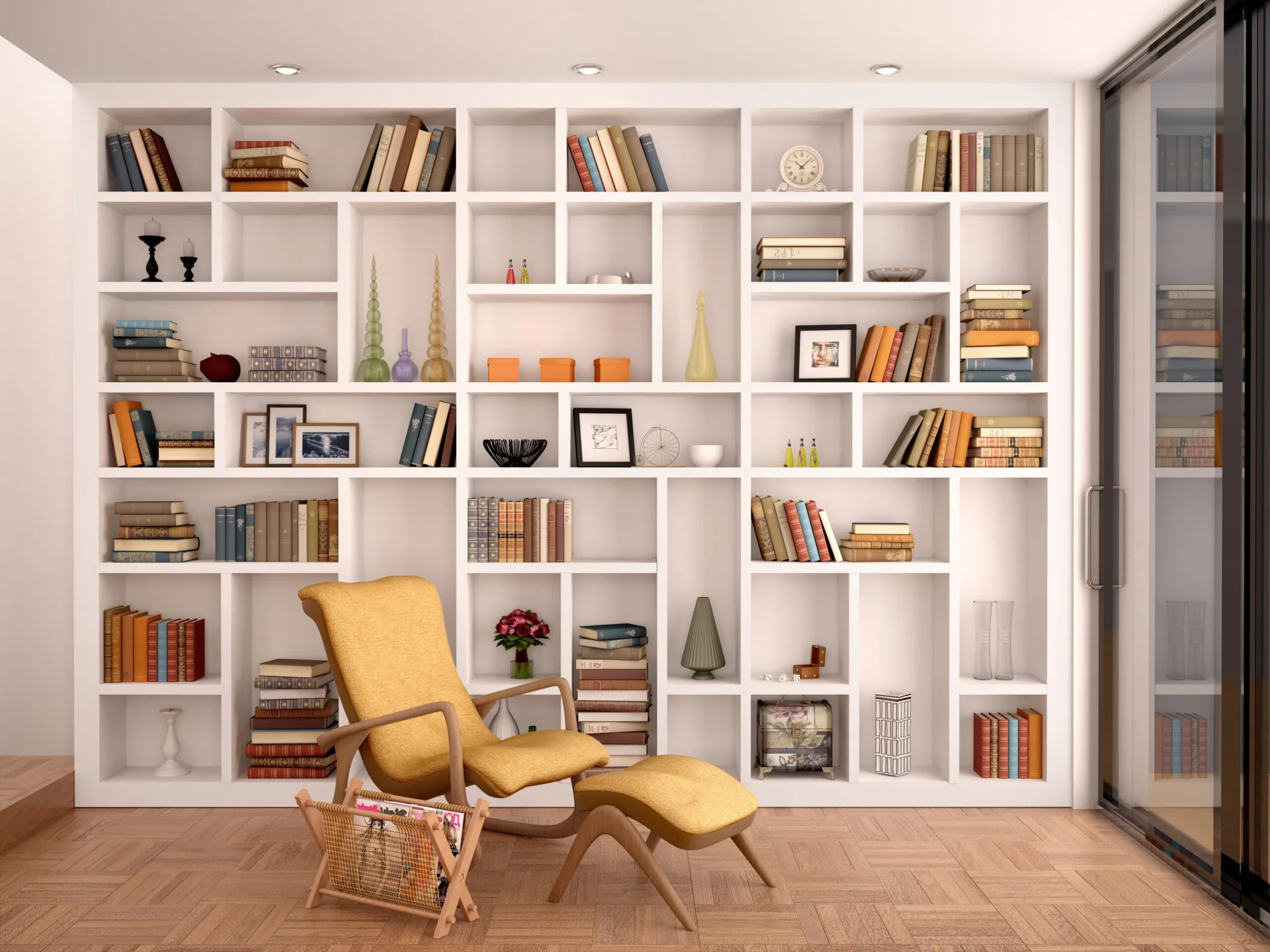 A home library features floor-to-ceiling white grid bookshelves, a yellow mid-century modern lounge chair with an ottoman, and parquet wood flooring.