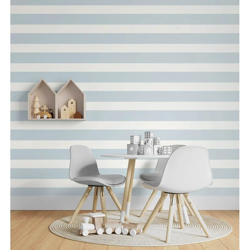A children's playroom features a small round table, white modern chairs, and a circular rug set against a blue and white striped wall.