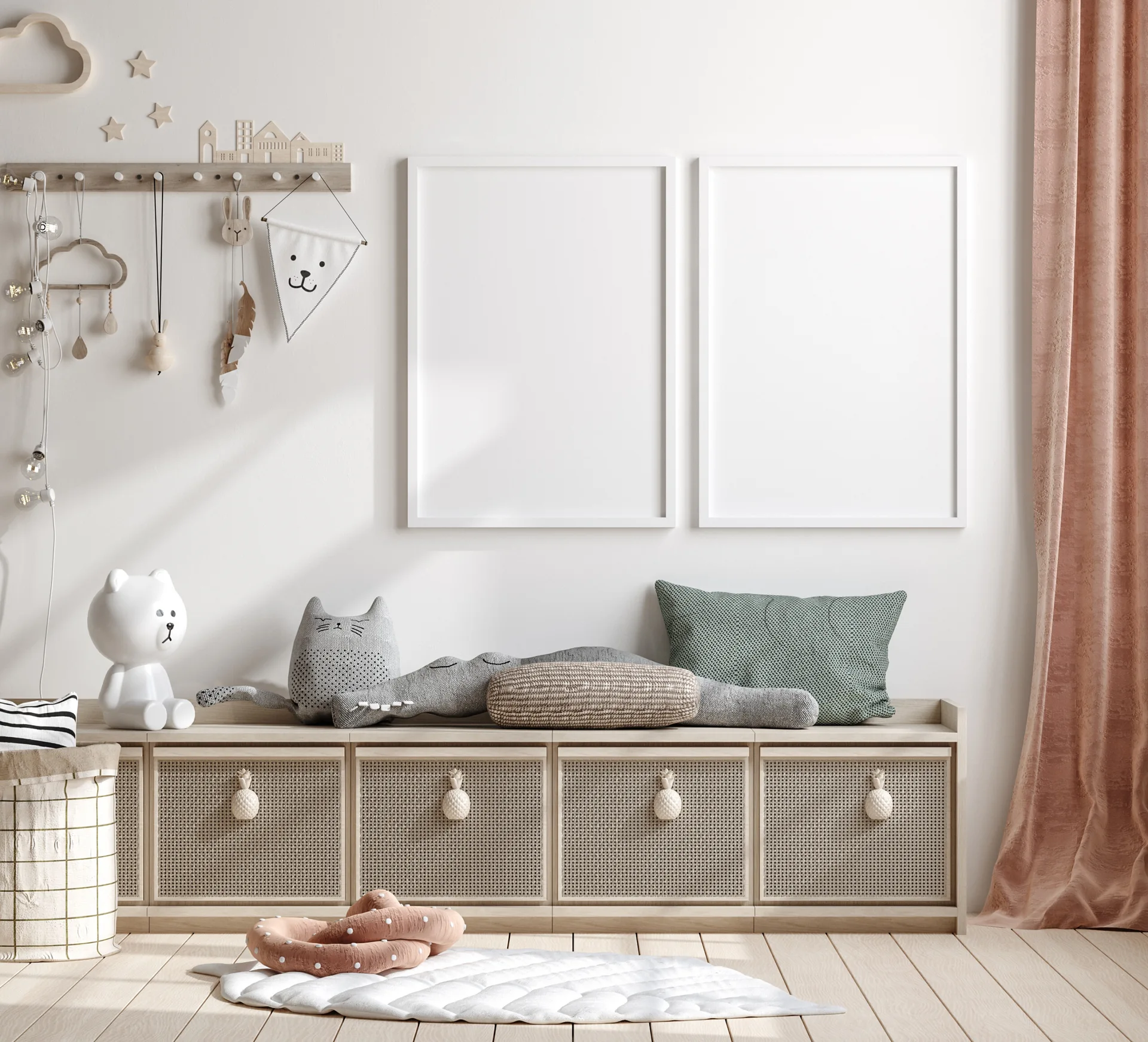 A bright children's playroom features a low light wood storage bench with cane drawer fronts, a white bear lamp, and two white picture frames on the wall.