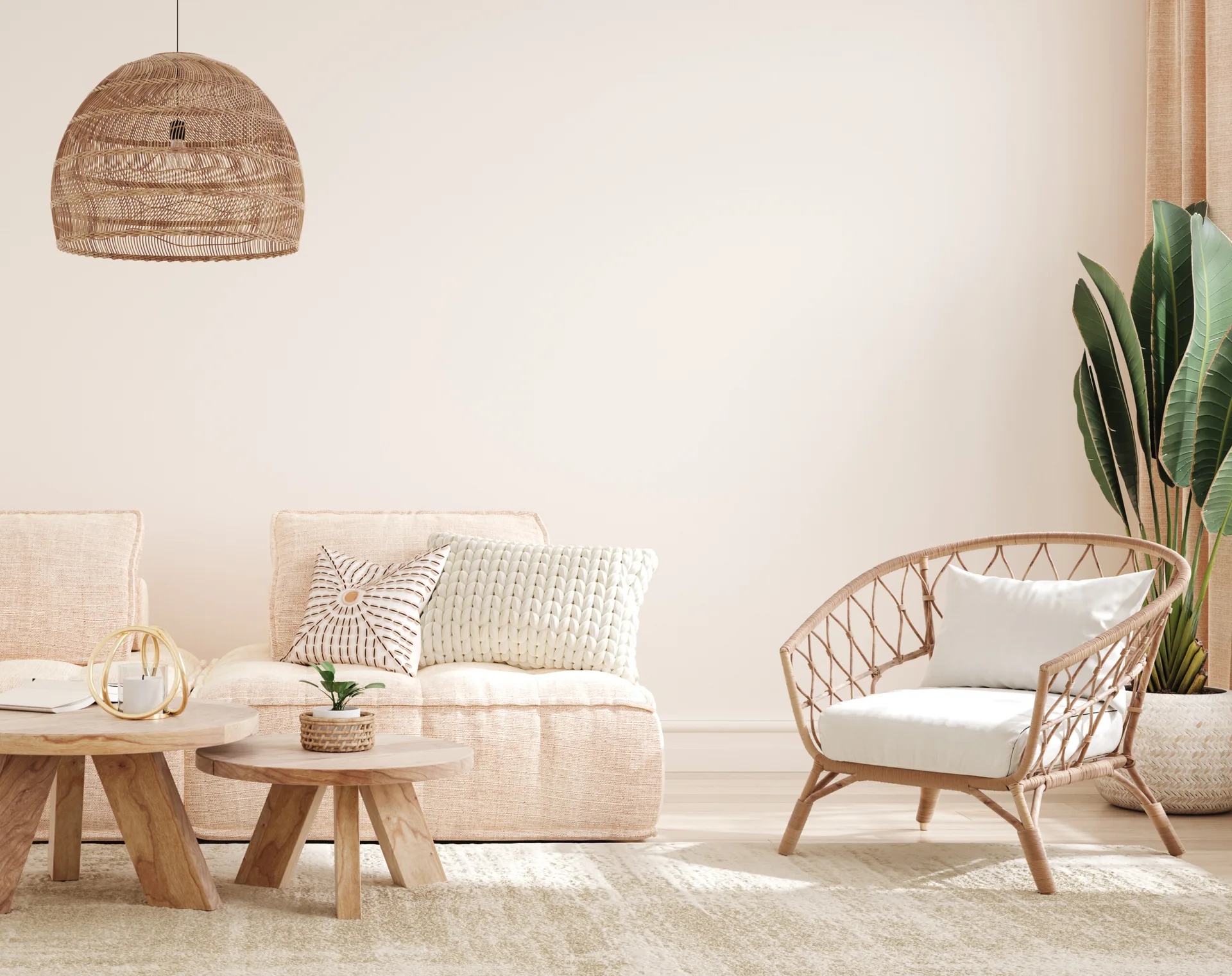 A neutral living room features a cream modular sofa, nested wooden coffee tables, a rattan armchair, and a large woven dome pendant light.