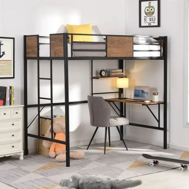 A black metal loft bed with wood-toned panels features an integrated desk, a grey upholstered chair, and a geometric area rug.