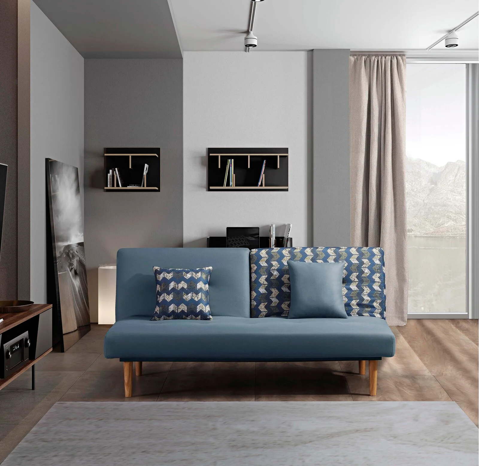 A modern living room features a blue sofa with geometric pillows, dark floating shelves on a grey wall, and a large window.