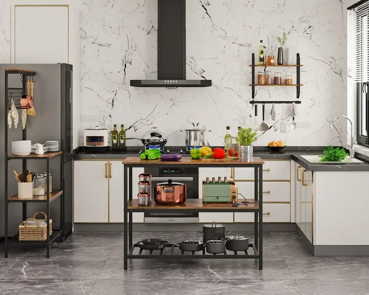 A modern kitchen with white cabinetry, a dramatic veined marble backsplash, and a freestanding wood and metal island cart.
