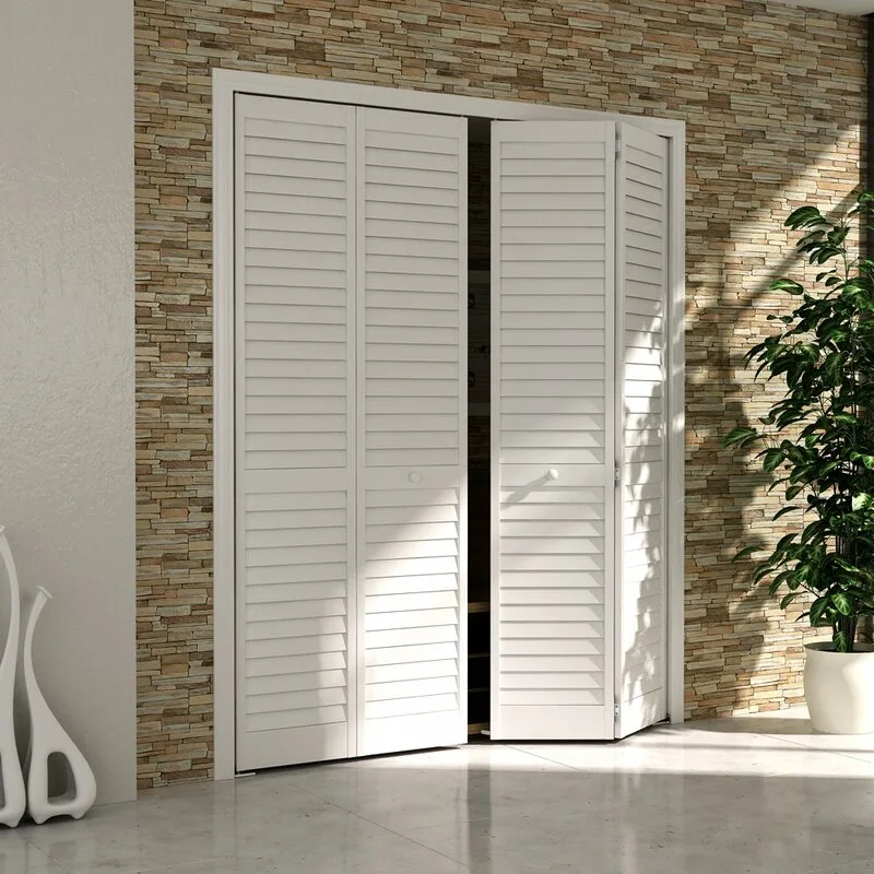 White louvered bifold closet doors are slightly open against a textured beige stacked stone accent wall next to a potted green plant.
