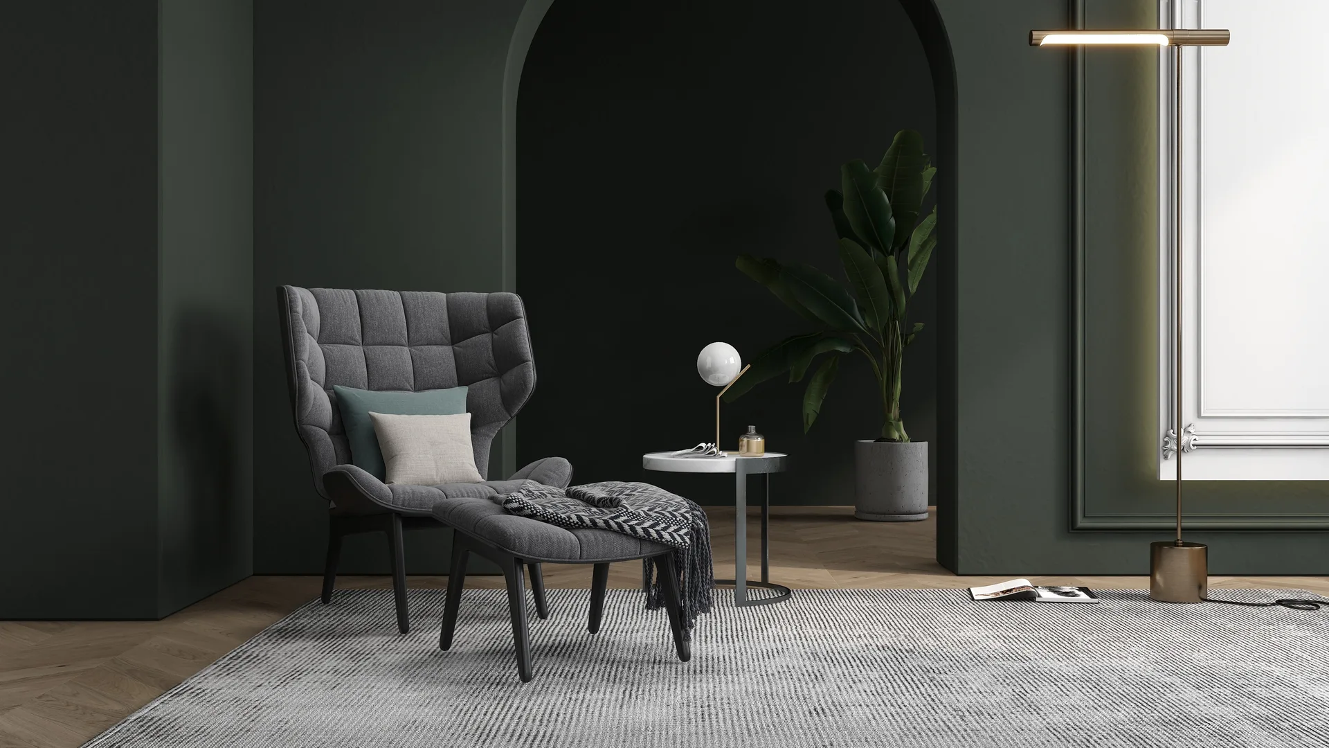 A grey tufted armchair and ottoman sit on a textured rug in a room with dark olive green walls, a large archway, and herringbone wood floors.