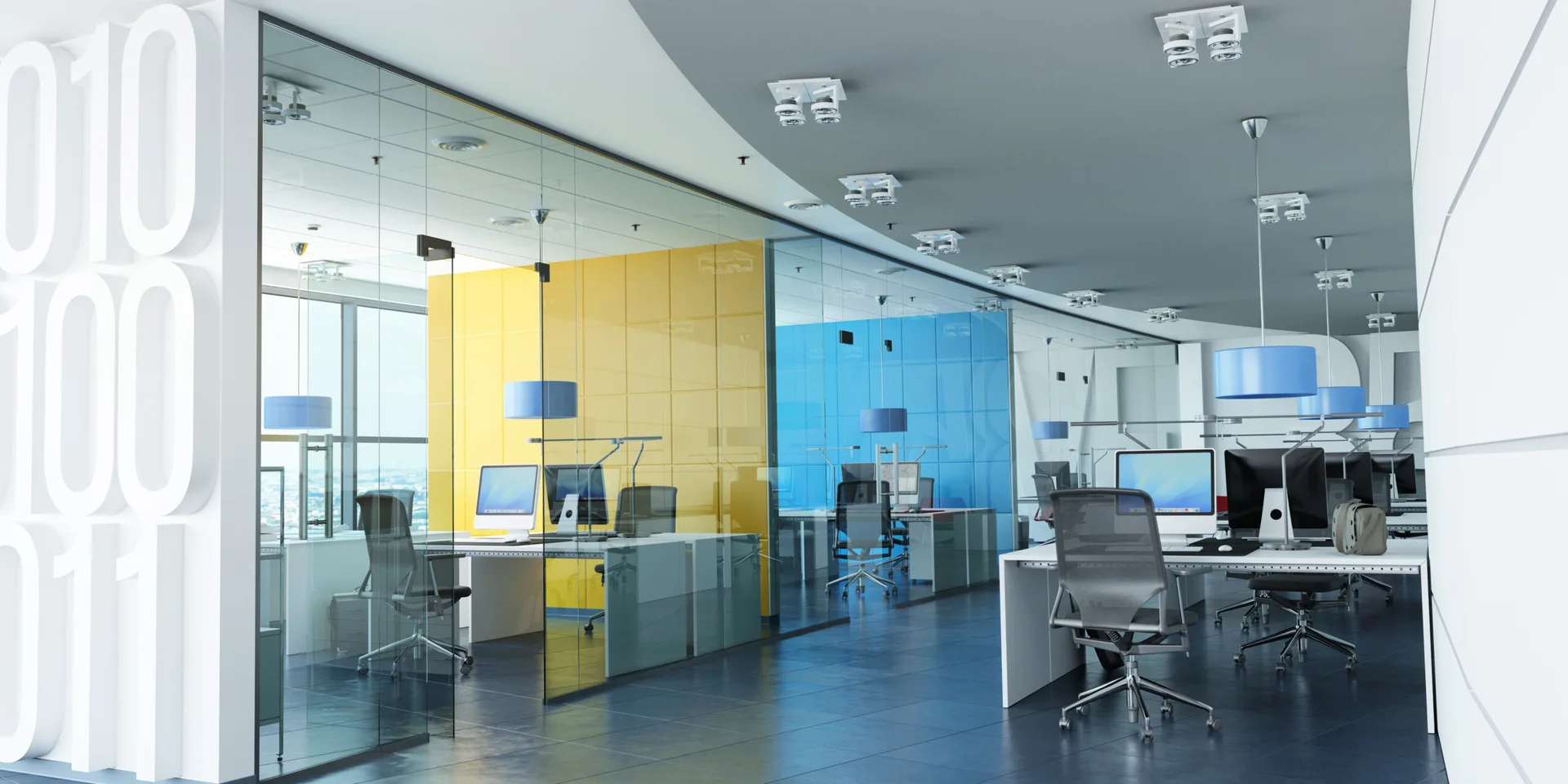 An open-plan office space featuring white desks with glass partitions, ergonomic mesh chairs, and bold blue and yellow gridded accent walls.