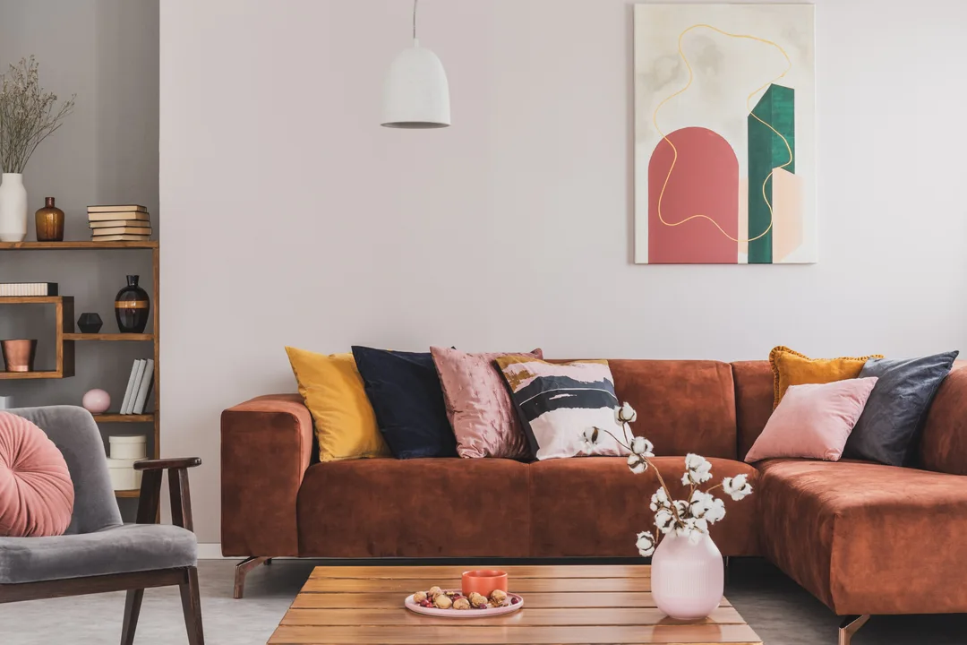 Cozy, brown corner sofa with decorative cushions
