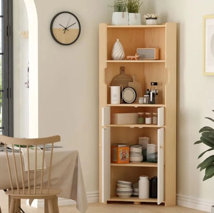 A tall light wood corner cabinet with white doors and open shelves displaying tableware stands in a neutral dining room.