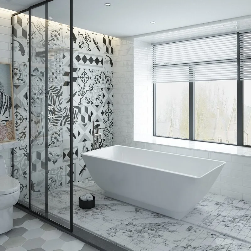 A modern bathroom features a white freestanding bathtub next to a glass-enclosed shower with bold black and white patterned tiles.