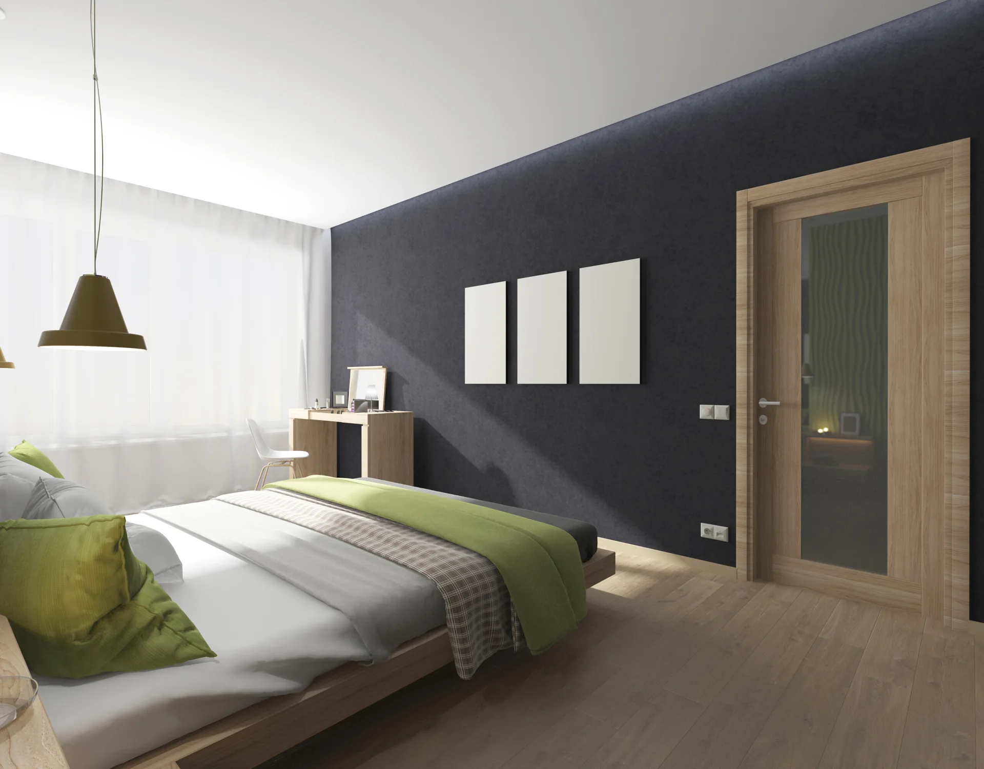 A minimalist bedroom featuring a charcoal accent wall, a low platform bed with green blankets, a wooden desk near a window, and wood flooring.