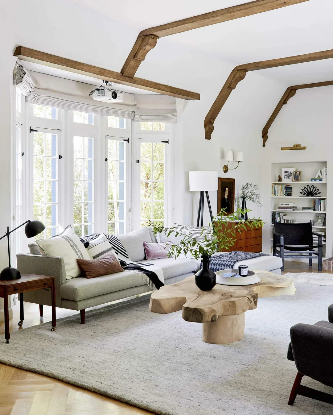 Modern living room with large window and timber coffee table&nbsp;