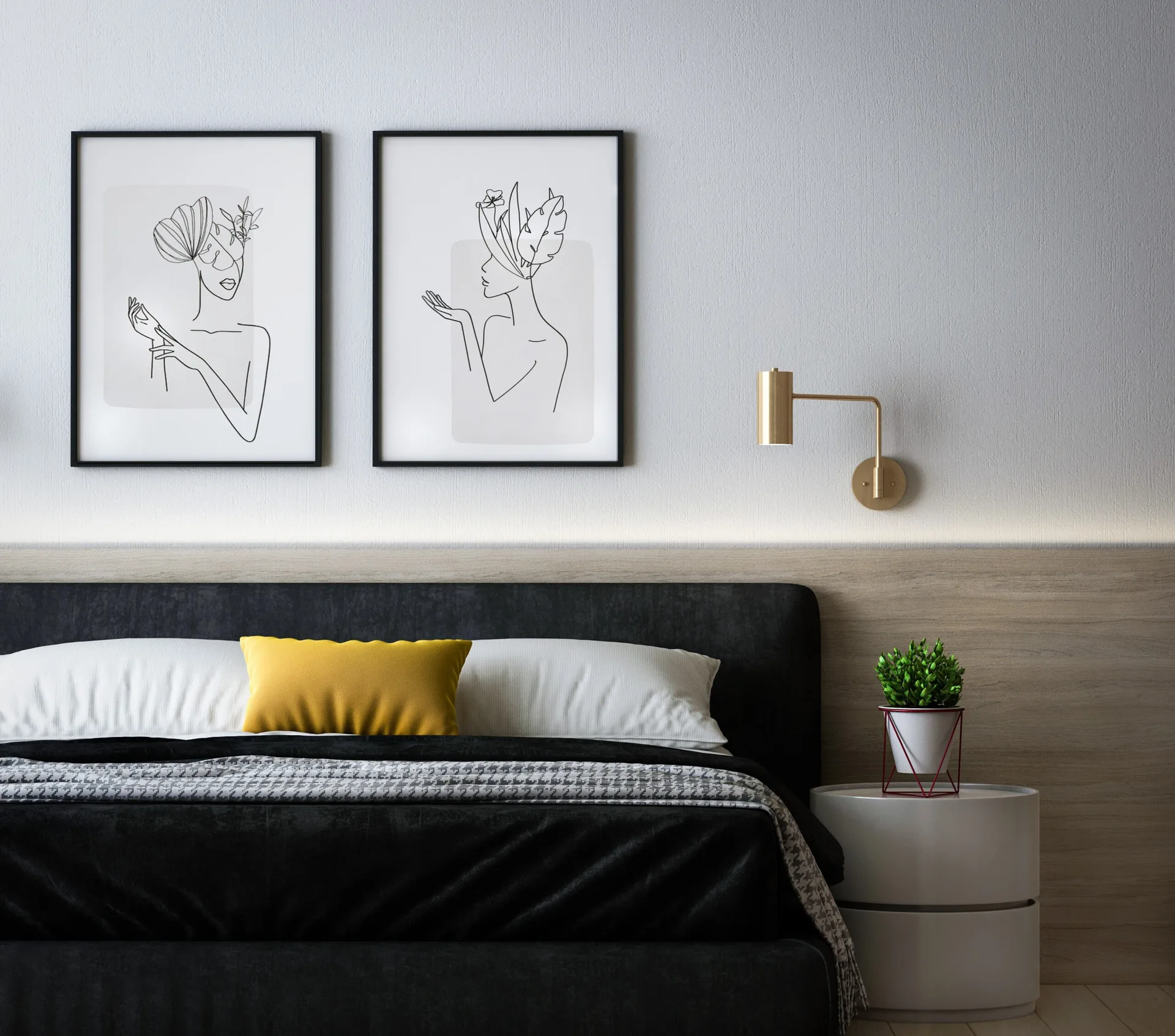 A modern bedroom features a black upholstered bed with a yellow pillow, a low wood-paneled accent wall, and two framed minimalist line art prints.