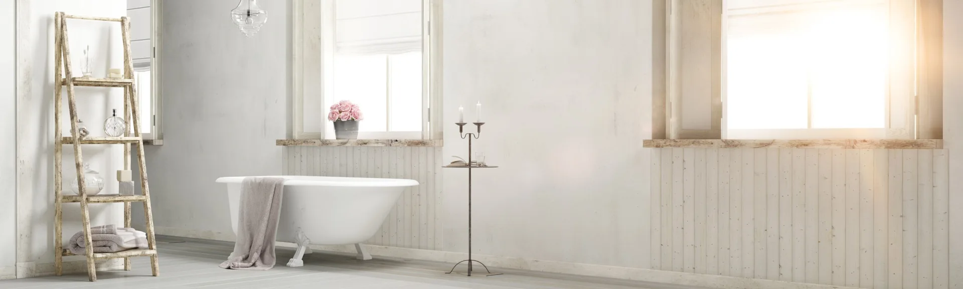 A bright bathroom features a white clawfoot bathtub next to a rustic wooden ladder shelf and vertical beadboard wainscoting under windows.