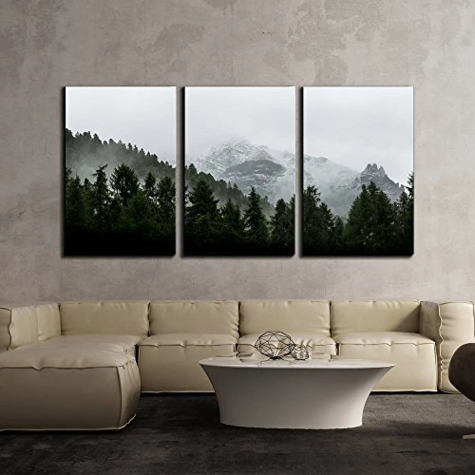 A modern living room features a modular cream sectional sofa and a three-panel mountain landscape triptych hanging on a textured gray wall.