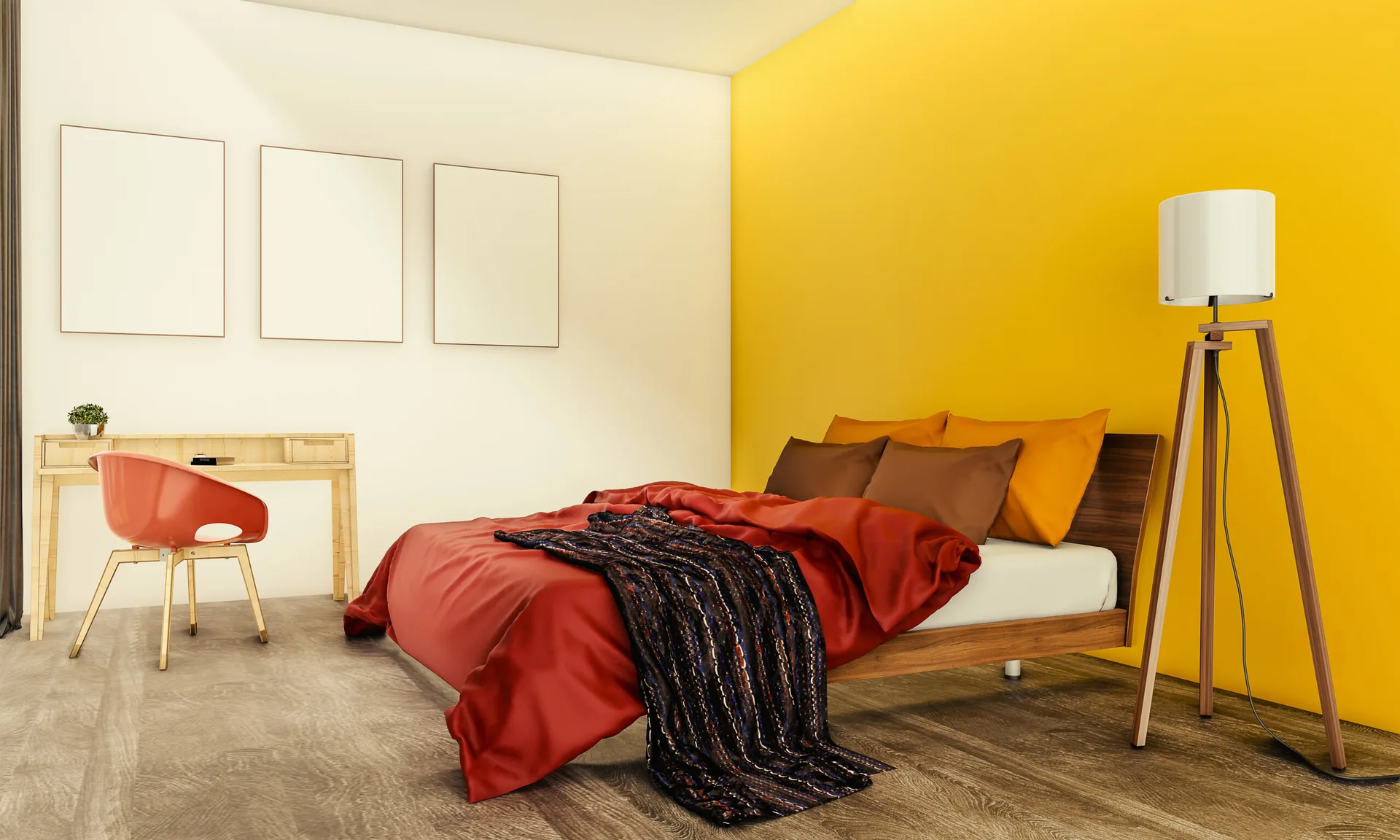 A minimalist bedroom featuring a wood platform bed against a bright yellow accent wall and a light wood desk with three blank triptych frames.