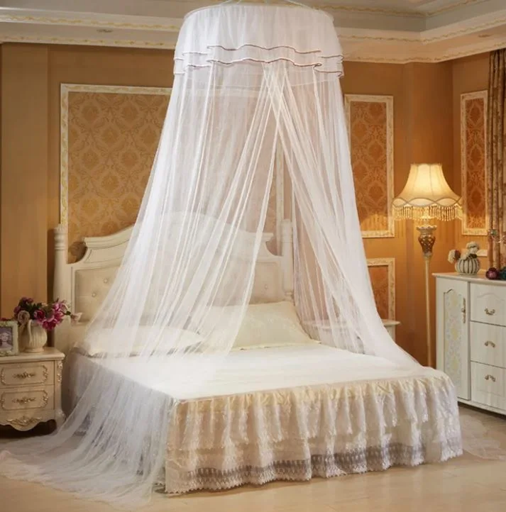 A traditional bedroom features a bed draped in a sheer white hoop canopy, flanked by ornate beige nightstands and damask wall paneling.
