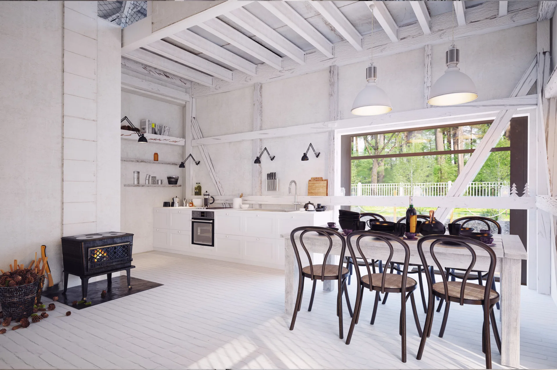 A bright farmhouse kitchen and dining area with whitewashed wood finishes, a rustic dining table with black chairs, and a black cast iron stove.