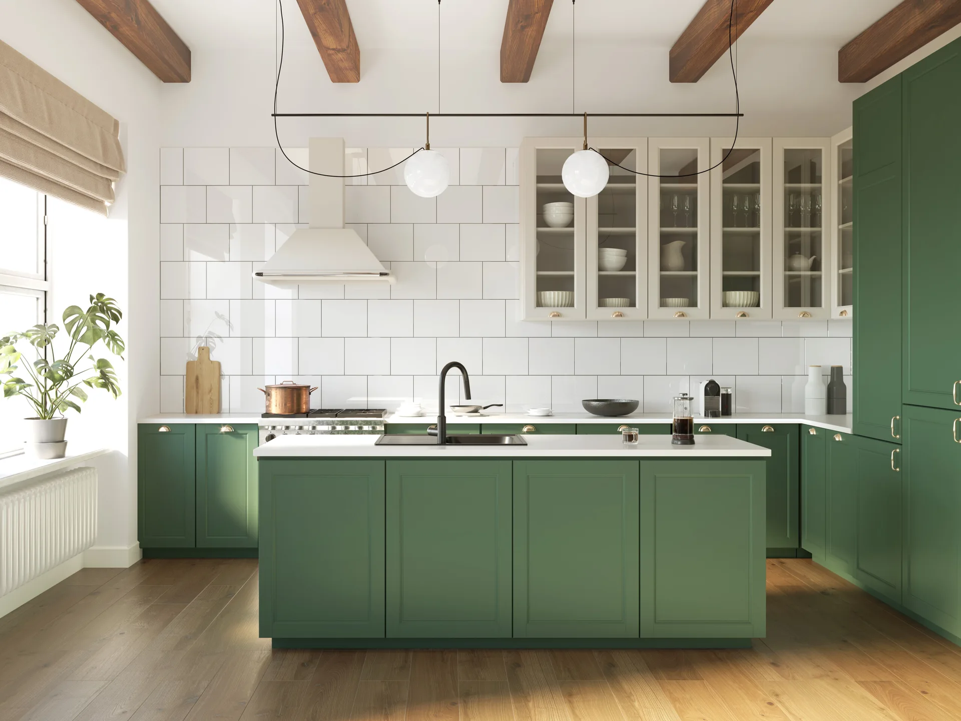 A modern farmhouse kitchen features sage green cabinetry, a matching island, a white subway tile backsplash, and dark exposed wooden ceiling beams.