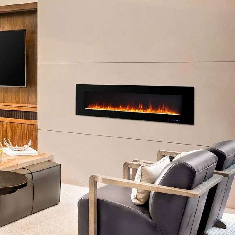 A horizontal black electric fireplace is mounted on a beige paneled wall in a modern living room next to two leather armchairs.