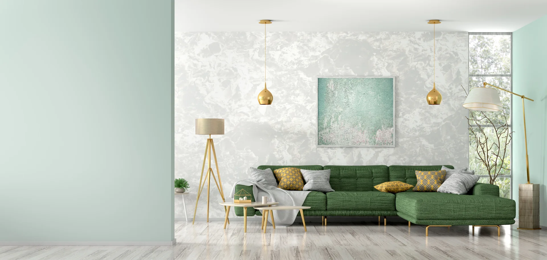 A contemporary living room featuring a green sectional sofa against a textured gray wall with hanging gold pendant lights.