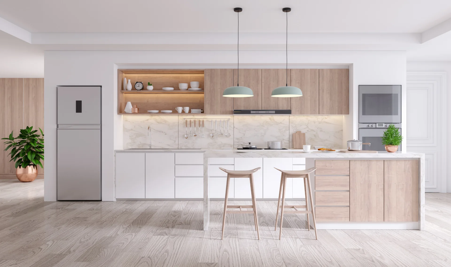 A modern kitchen with two-tone cabinetry, a marble-patterned backsplash, wooden bar stools, and two sage green pendant lights over the island.