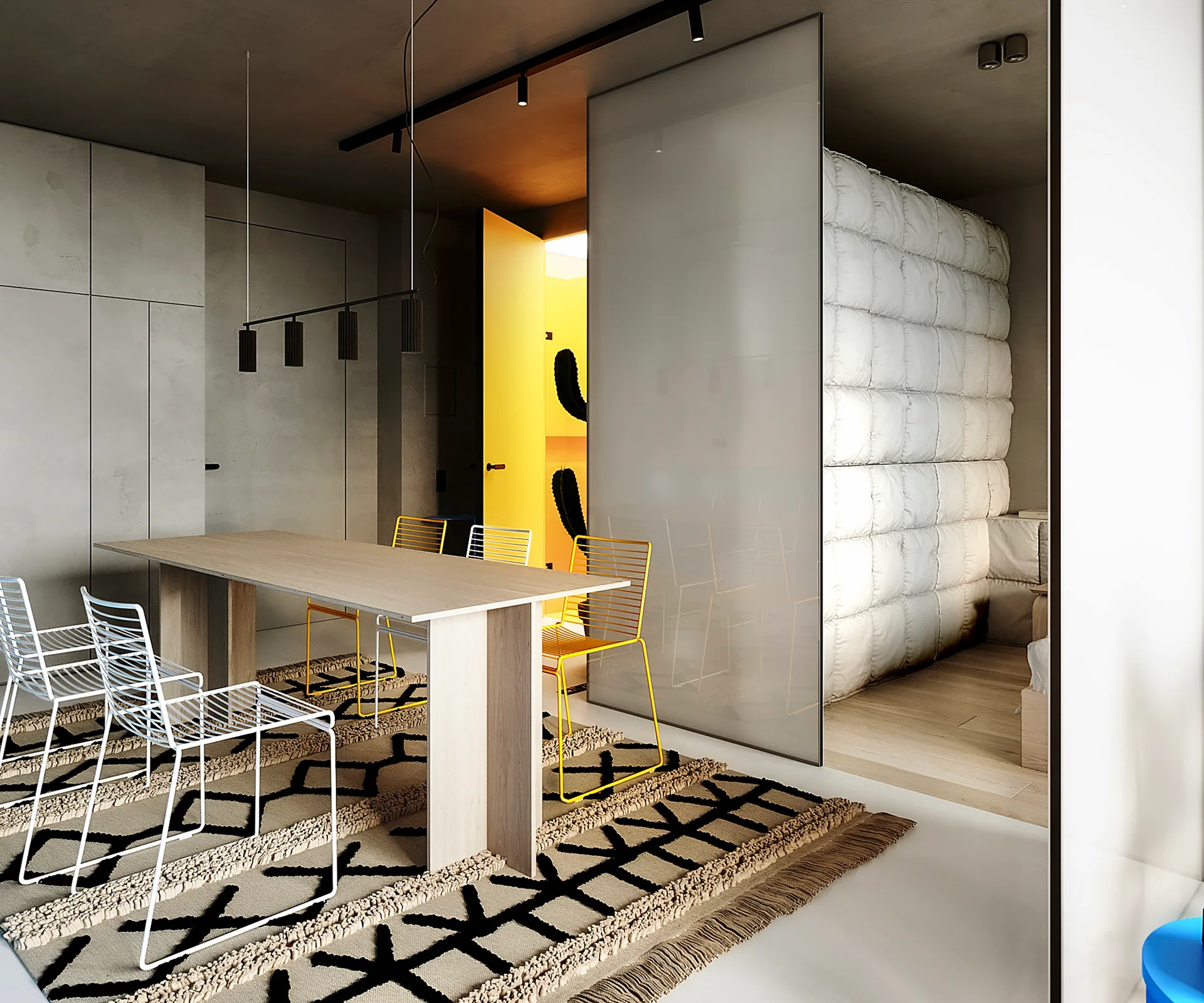A modern dining room features a light wood table, yellow and white wire chairs on a geometric rug, and a sliding glass partition.