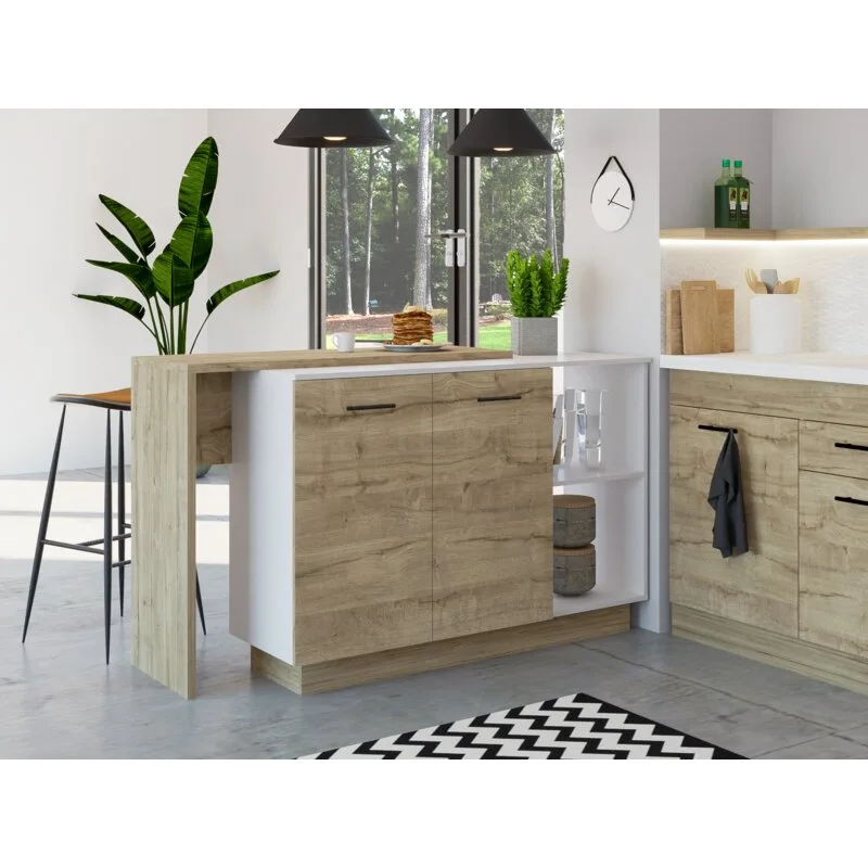 A modern kitchen features a two-tone wood and white island with a built-in breakfast bar, black pendant lights, and a chevron rug on a concrete floor.