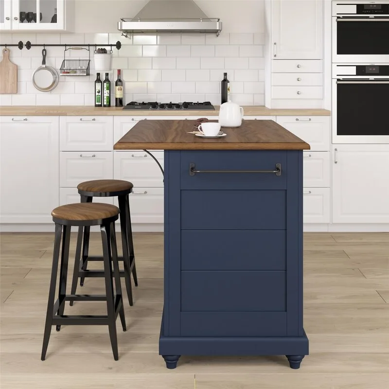A white kitchen features a navy blue island with a wood countertop, matching wood-seated stools, and a white subway tile backsplash.