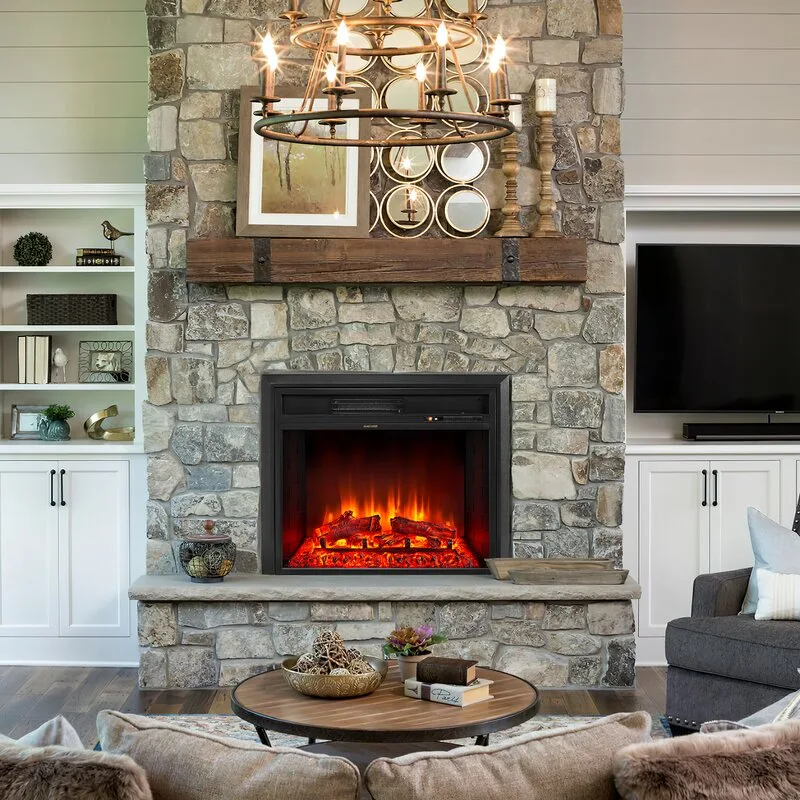 A living room with a floor-to-ceiling stone fireplace flanked by symmetrical white built-in cabinets and shelving.
