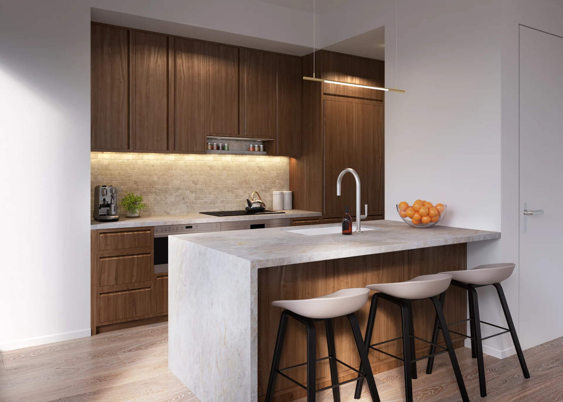 A modern kitchen features dark wood cabinetry, a stone-topped waterfall island with three bar stools, and warm under-cabinet lighting.