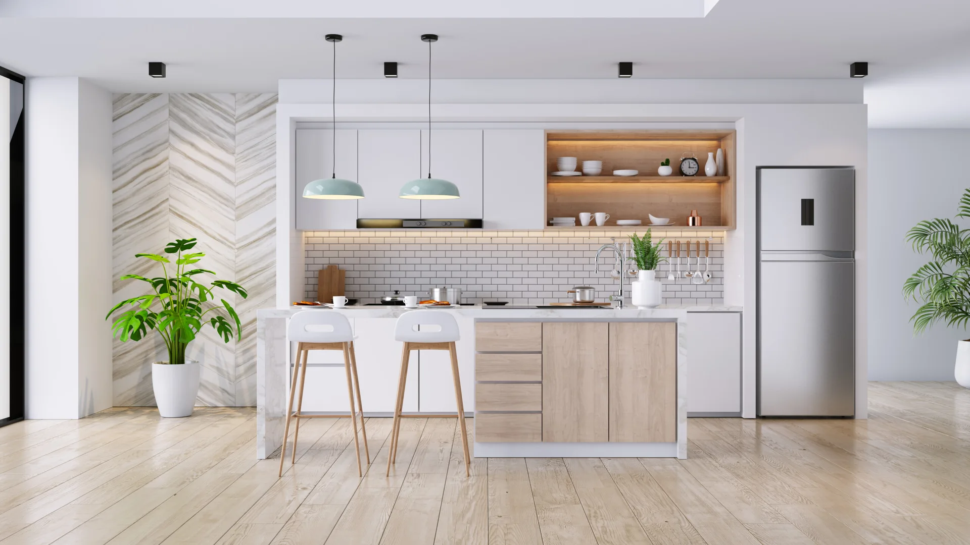 A bright kitchen features a white-marble-topped island with wood cabinets, matching bar stools, white upper cabinetry, and a herringbone accent wall.