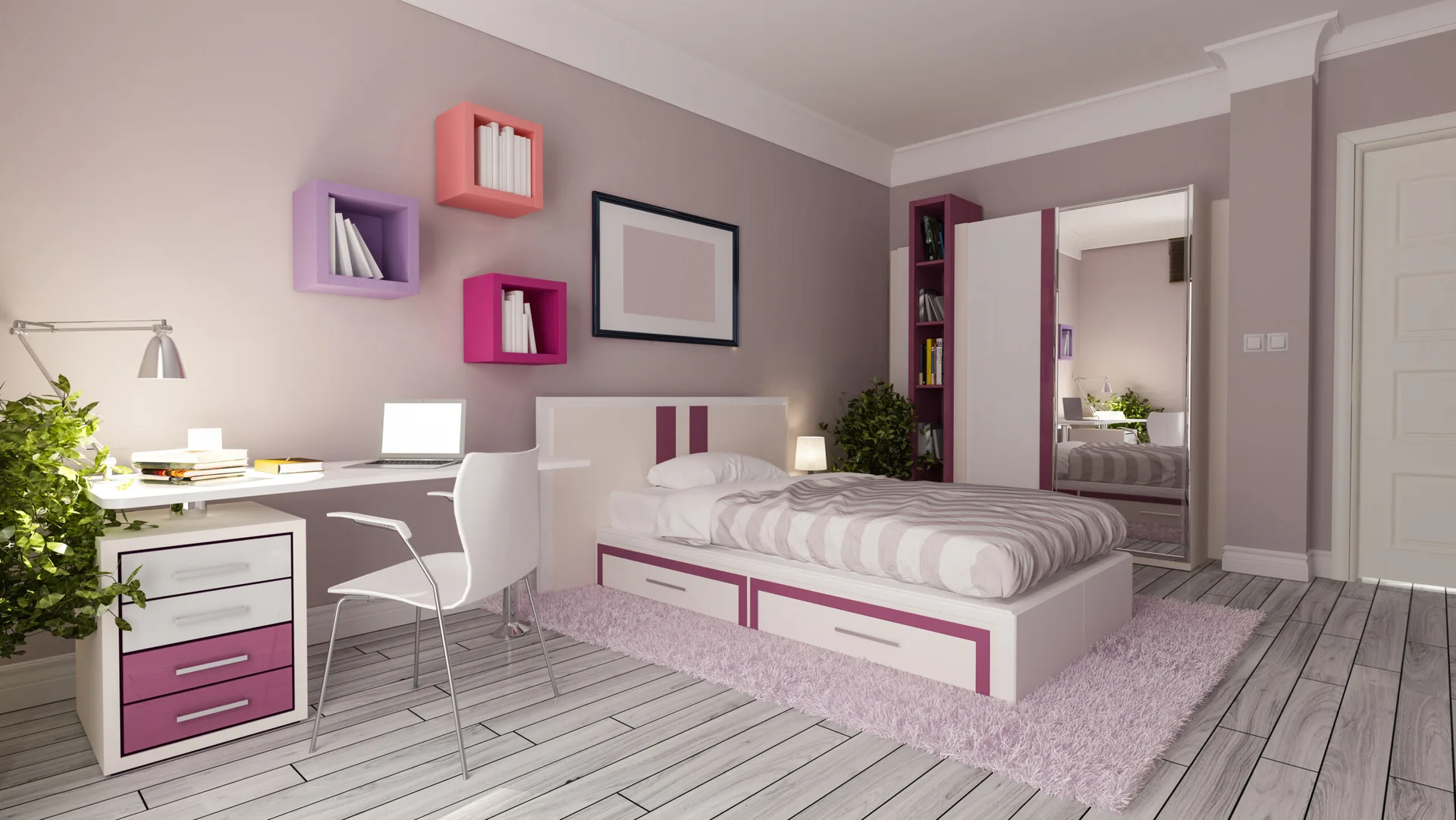 A lavender-walled bedroom features a white platform bed with magenta drawers, a study desk, colorful floating box shelves, and a mirrored wardrobe.