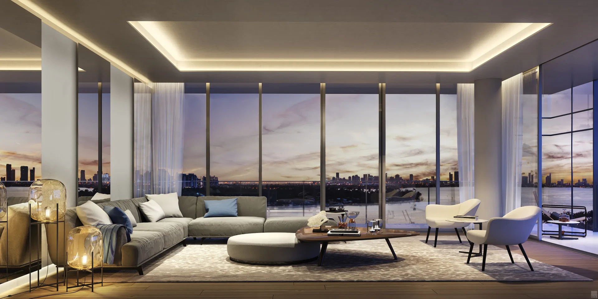 A modern living room featuring a grey sectional sofa, white armchairs, glass globe floor lamps, and large windows overlooking a city skyline at sunset.