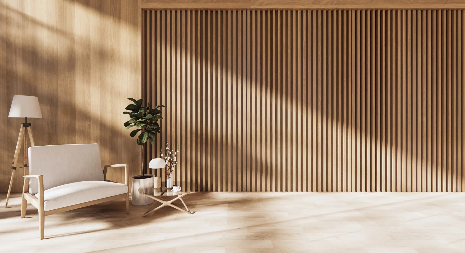 A minimalist living room with a slatted wood accent wall, a light gray armchair, a glass side table, and a tripod floor lamp.