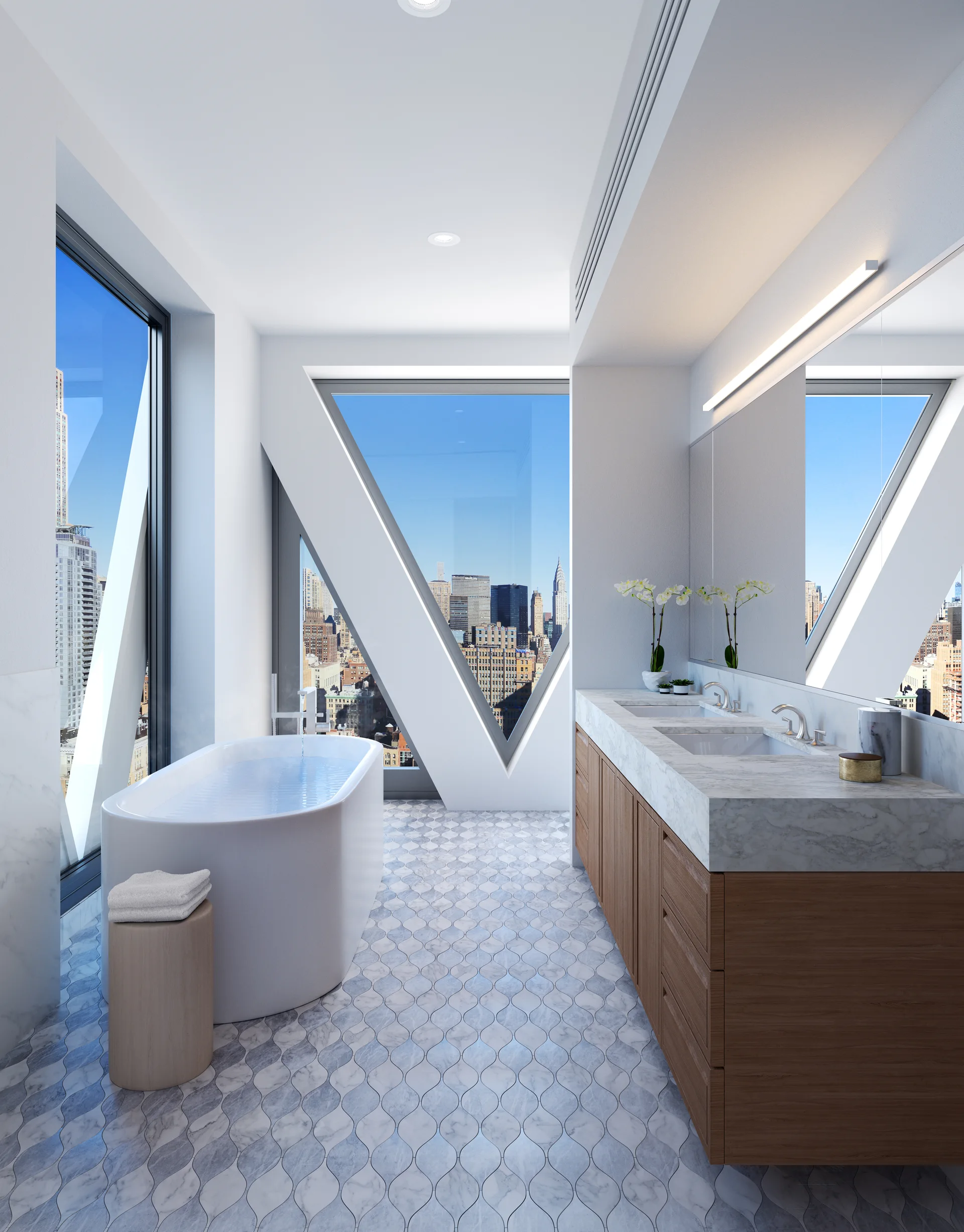 A contemporary bathroom featuring a freestanding white bathtub, a double wood vanity with a marble top, and large triangular windows overlooking a city.