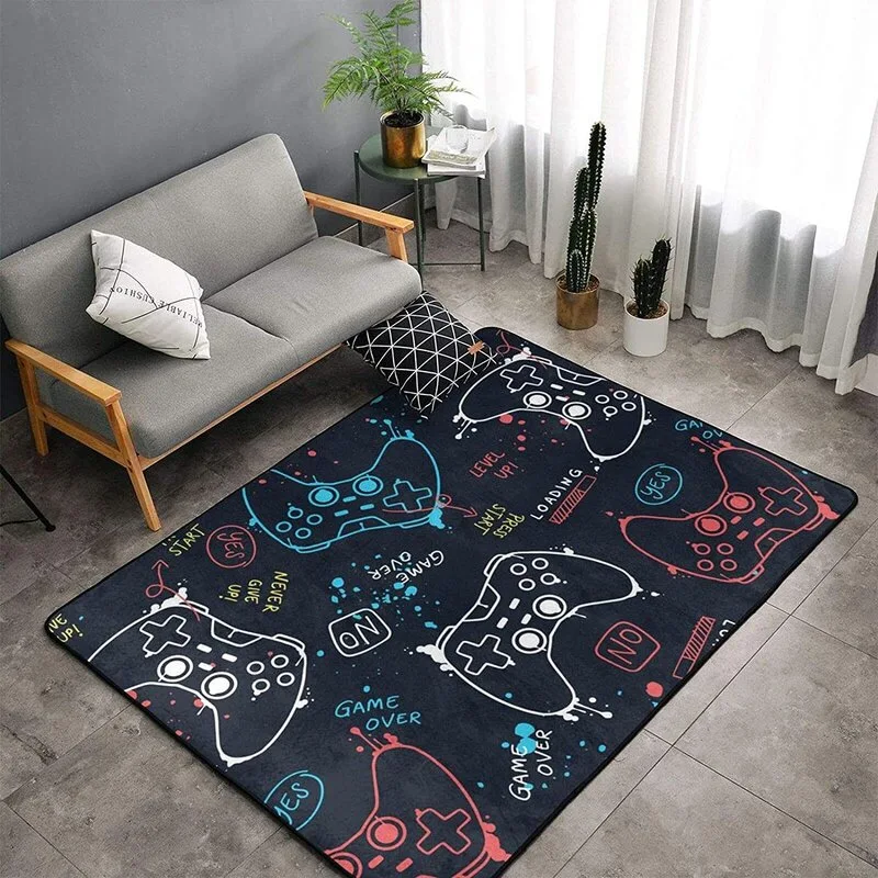 A dark grey rug with colorful game controller graphics sits in front of a grey sofa and potted plants near a bright window.
