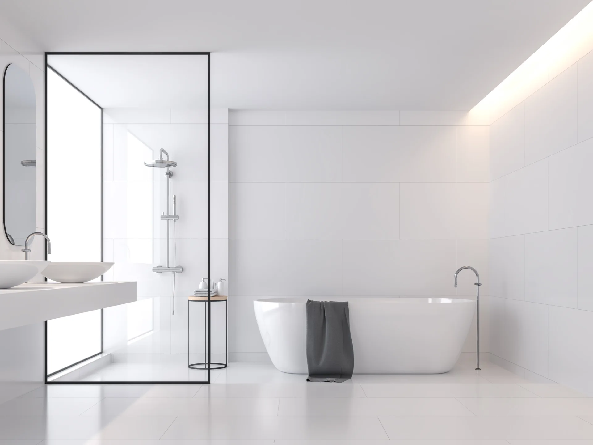 A minimalist white tiled bathroom features a freestanding bathtub, a floating vanity with vessel sinks, and a glass-enclosed shower with black metal framing.