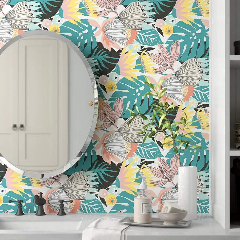 A bathroom vanity features a round frameless mirror and a dark three-piece faucet set against colorful tropical leaf wallpaper.