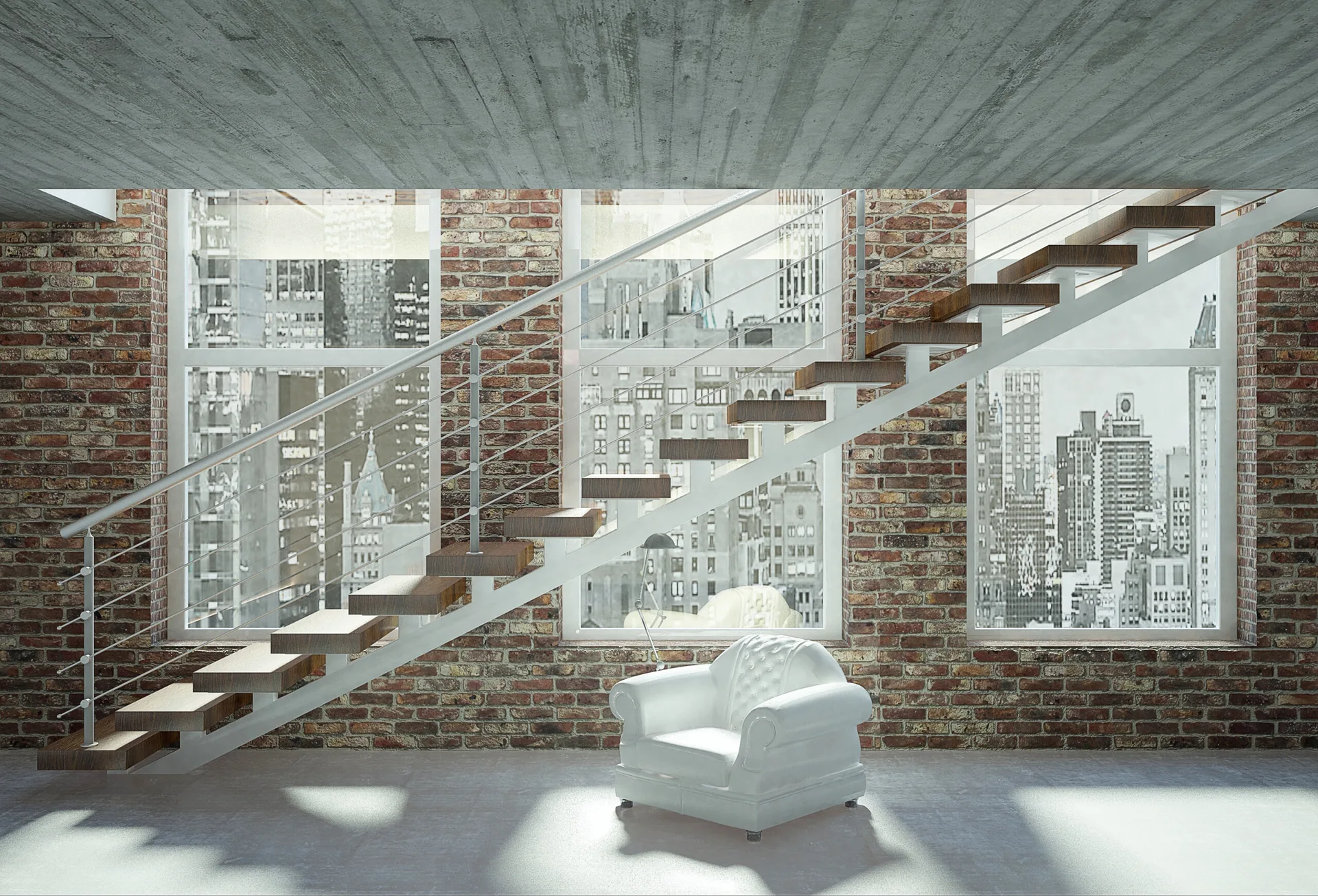An open-riser wood staircase runs along an exposed brick wall next to a white leather armchair on a concrete floor with city views.