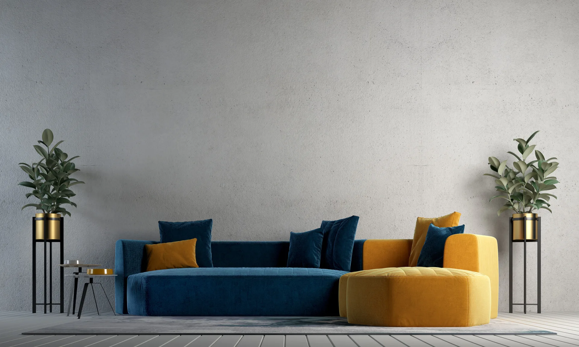 A modern blue and yellow modular sofa sits against a textured gray concrete wall flanked by symmetrical potted plants on gold stands.