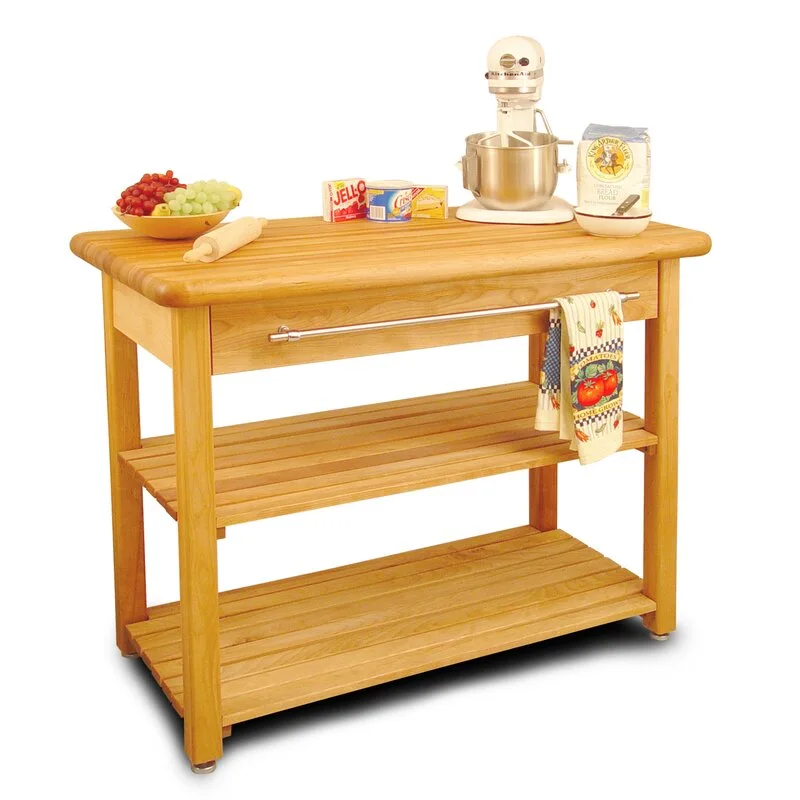 A light wood kitchen island cart with two slatted lower shelves, a drawer, and a steel towel bar.