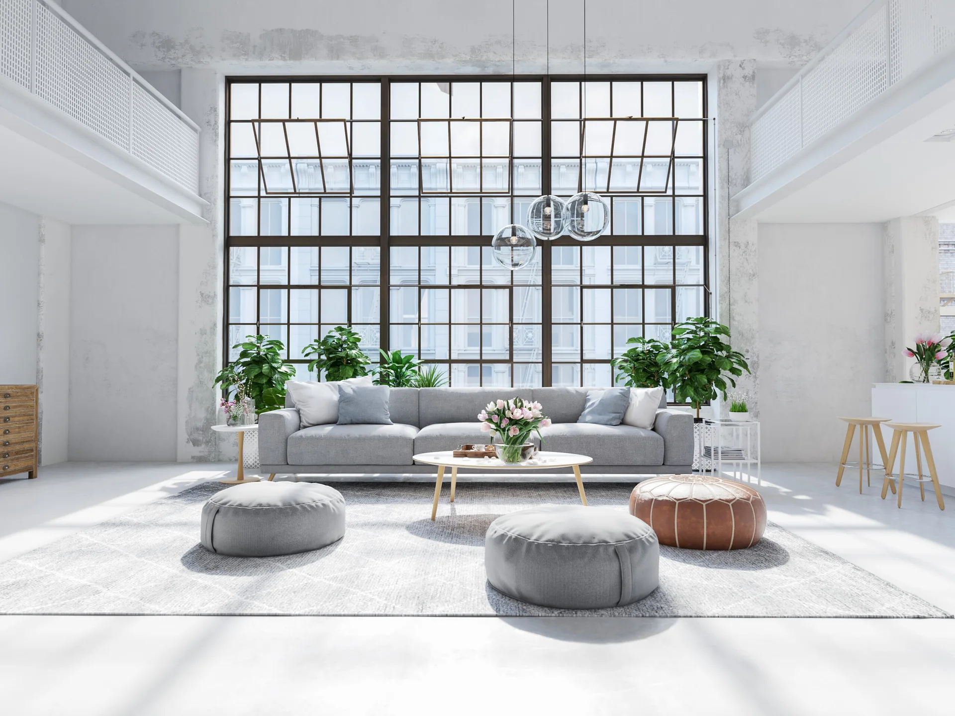 A symmetrical loft living room featuring a grey sofa, glass globe pendant lights, and a large black metal grid window.