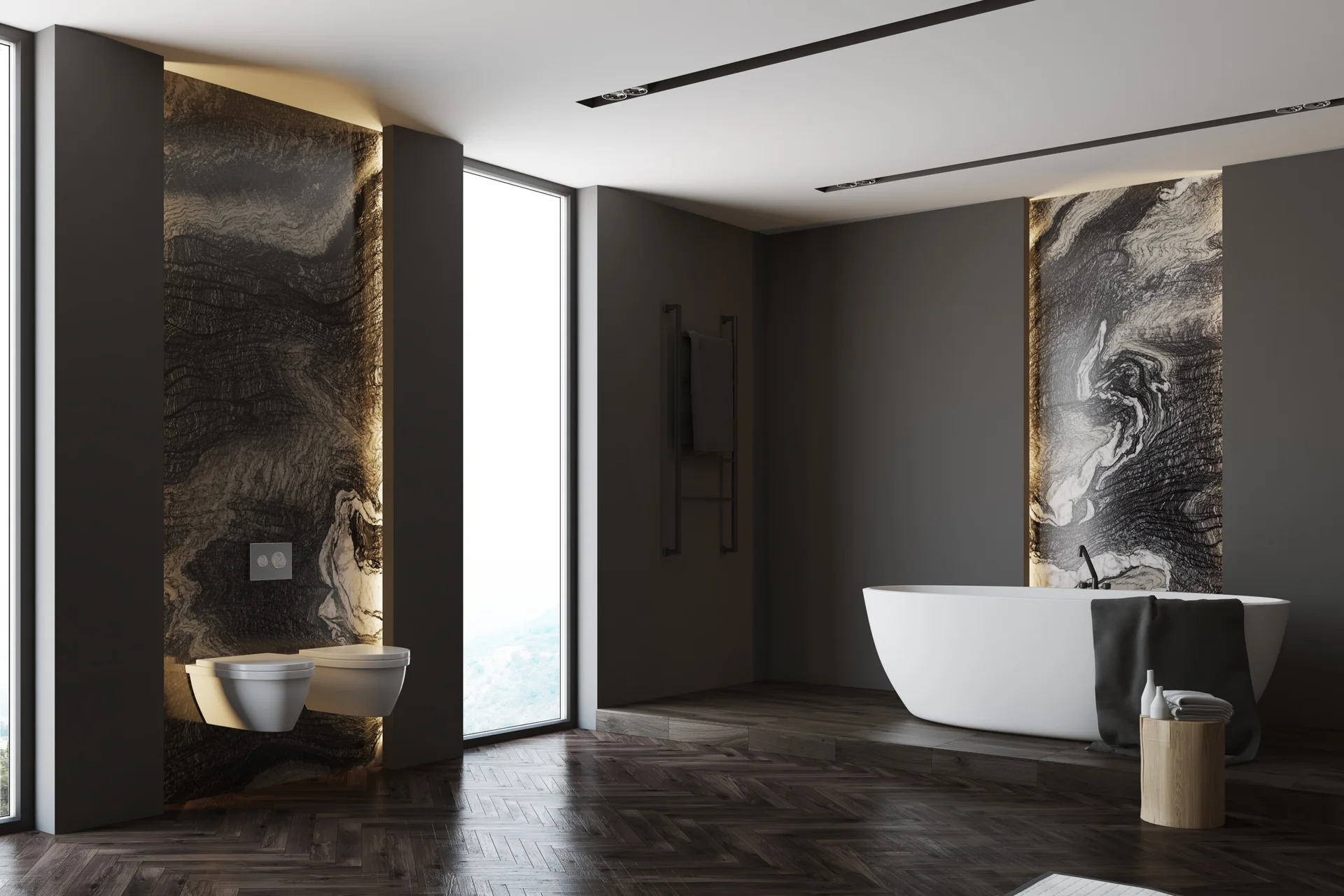 A dark gray modern bathroom features a white freestanding bathtub on an elevated wood platform and wall-mounted toilets against backlit veined stone panels.